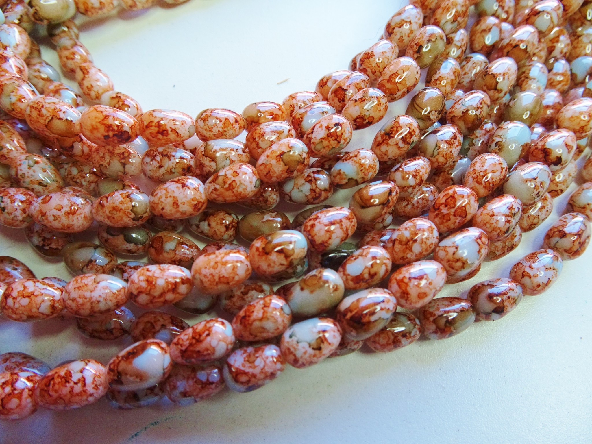 (image for) Rust and pale blue glass barrel beads 32" strand 10x14mm #1989